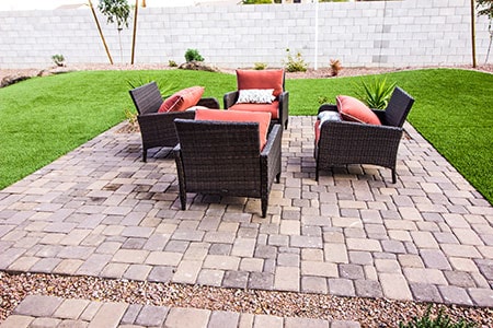 Outdoor Pavers Patio with Four Wicker Chairs and Cushions